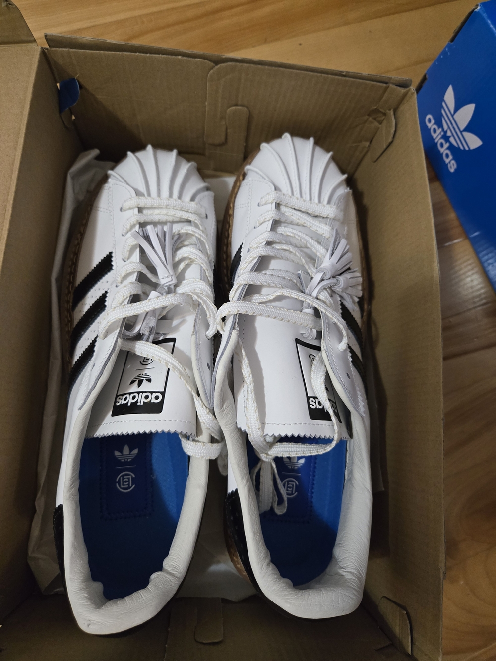 Limited Edition Adidas White Superstar Sneakers with Black Stripes
